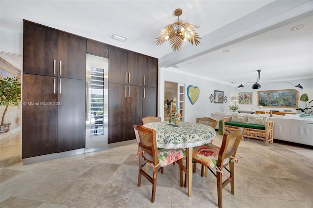 dining space featuring crown molding, plenty of natural light, and beverage cooler