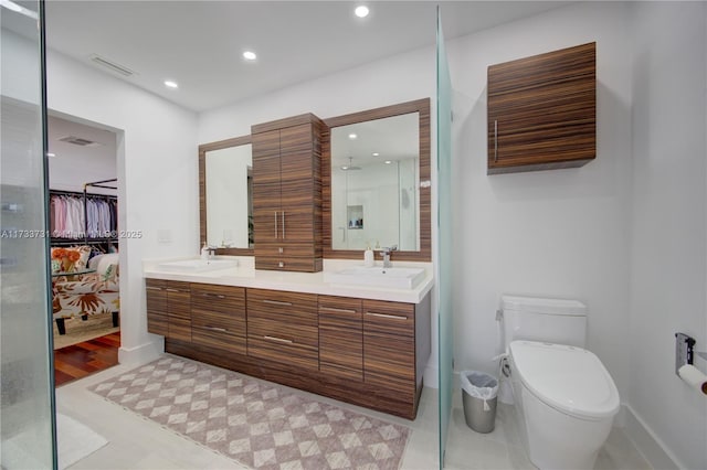 bathroom with vanity and toilet