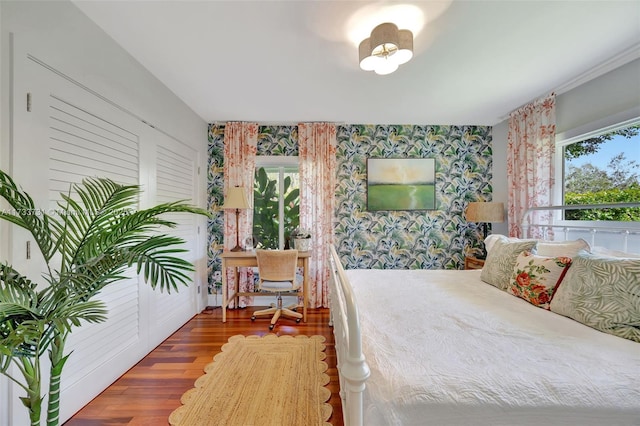 bedroom with hardwood / wood-style flooring