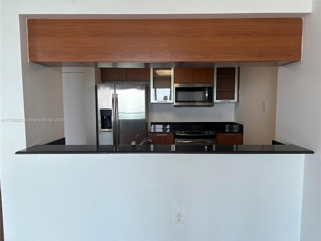 kitchen featuring stainless steel appliances and kitchen peninsula