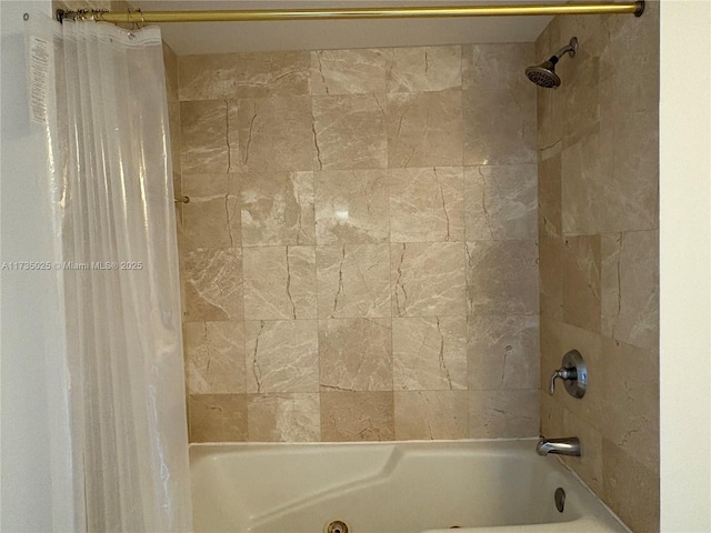 bathroom with shower / bathtub combination with curtain