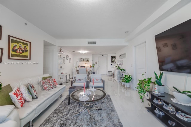 living room featuring a textured ceiling