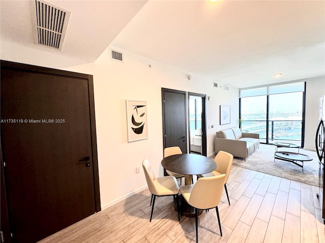 dining area featuring expansive windows