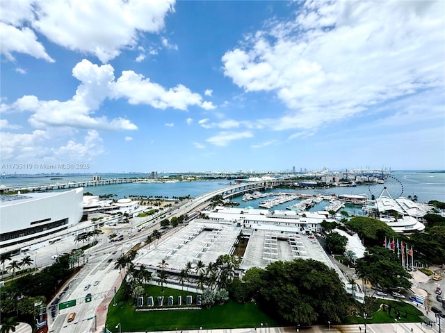 birds eye view of property with a water view