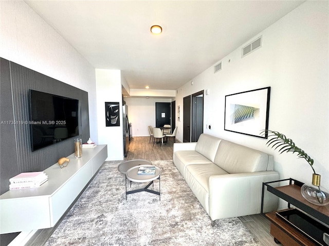 living room with wood-type flooring