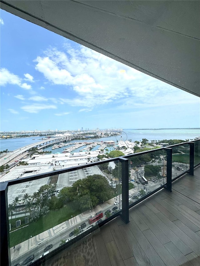 balcony featuring a water view