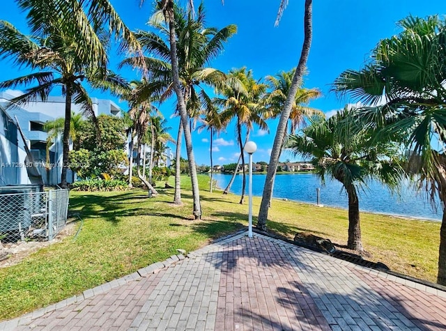 view of patio with a water view