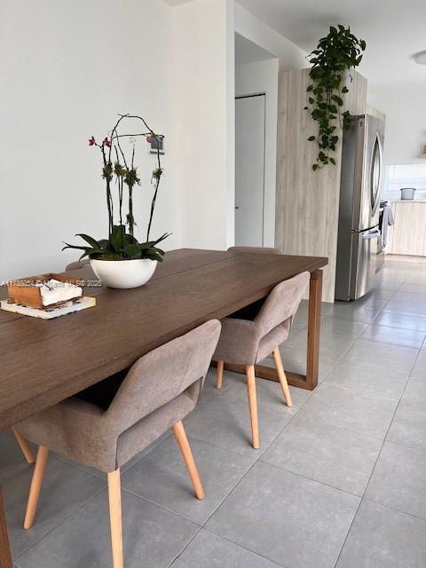 dining area featuring light tile patterned floors