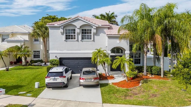 mediterranean / spanish house featuring a garage and a front yard