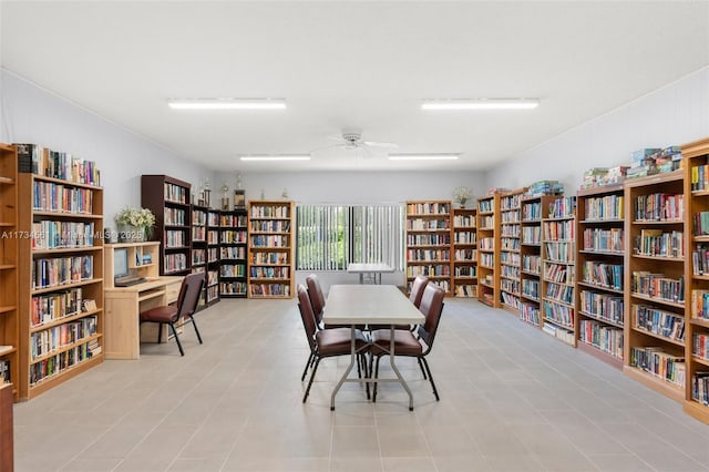 interior space with ceiling fan