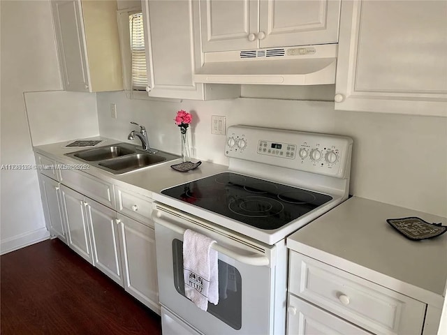 kitchen featuring white cabinets, sink, dark wood-type flooring, and electric range