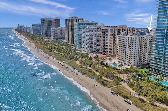 birds eye view of property featuring a view of the beach and a water view