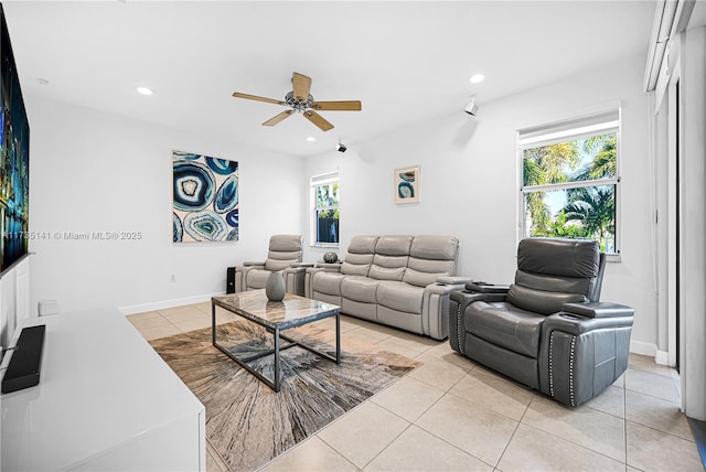 living room with light tile patterned flooring and ceiling fan