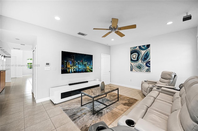 tiled living room with ceiling fan