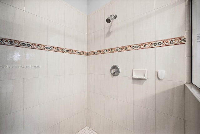 bathroom with a tile shower