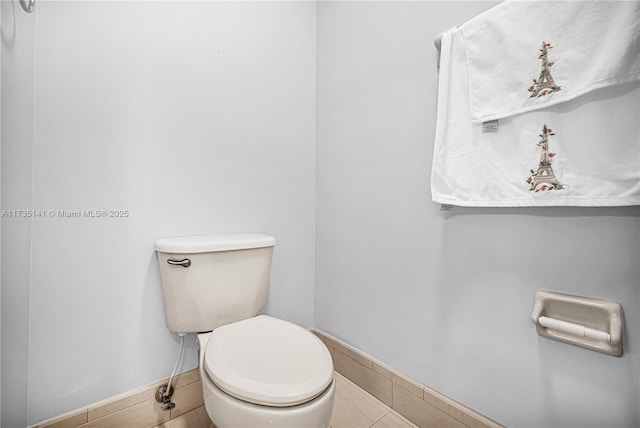 bathroom featuring tile patterned floors and toilet