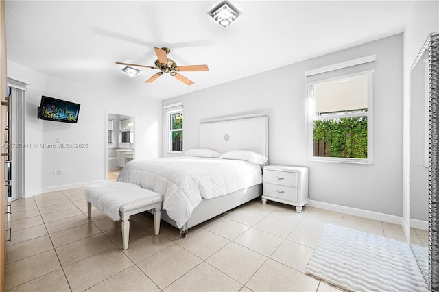 bedroom featuring light tile patterned floors and ceiling fan