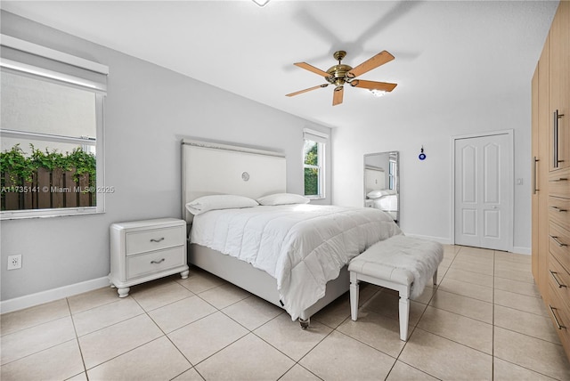 bedroom with light tile patterned floors and ceiling fan