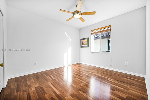 spare room with wood-type flooring and ceiling fan