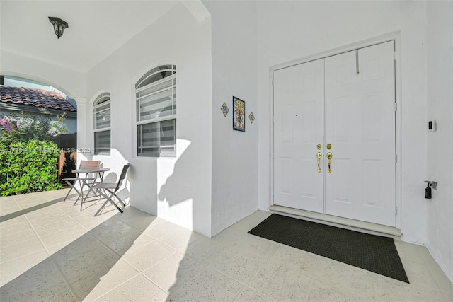 doorway to property with a porch