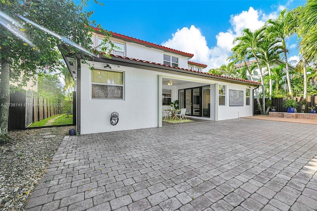 rear view of house with a patio