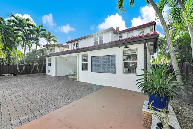 rear view of house featuring a patio