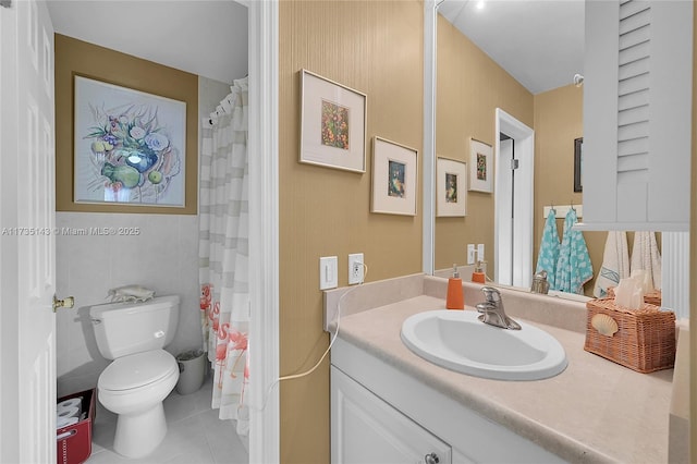 bathroom with vanity, tile patterned floors, and toilet