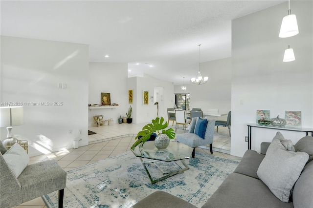 living room featuring light tile patterned flooring, lofted ceiling, and a notable chandelier