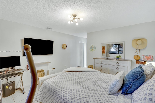 bedroom featuring a textured ceiling