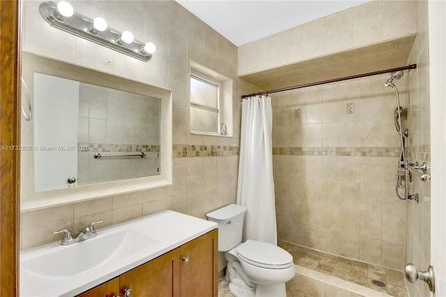 bathroom with tile walls, a shower with shower curtain, vanity, decorative backsplash, and toilet