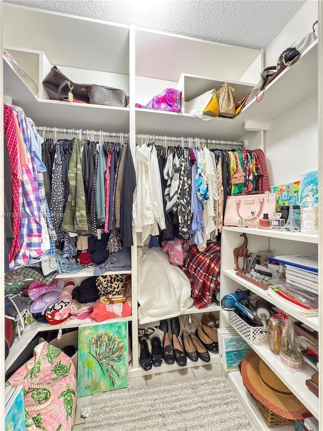 spacious closet with tile patterned flooring