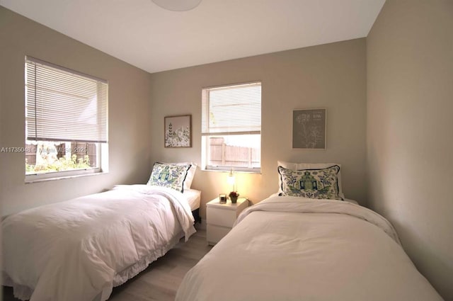 bedroom with light hardwood / wood-style floors