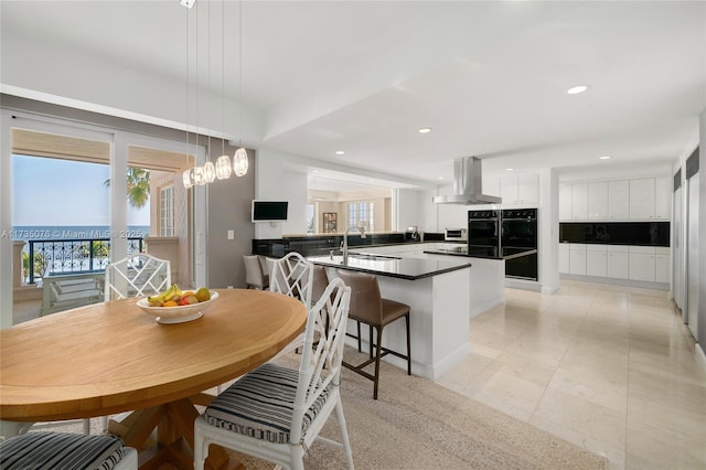 dining room with a healthy amount of sunlight and sink