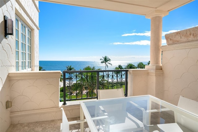 balcony featuring a water view