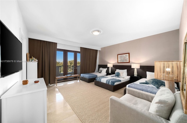 tiled bedroom featuring french doors