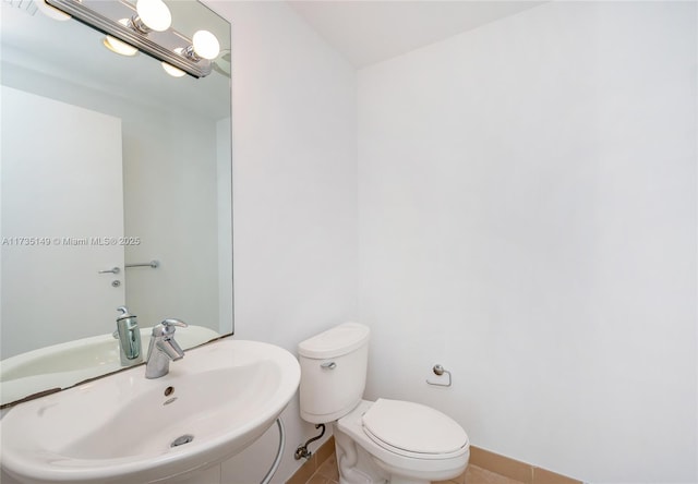 bathroom with sink and toilet