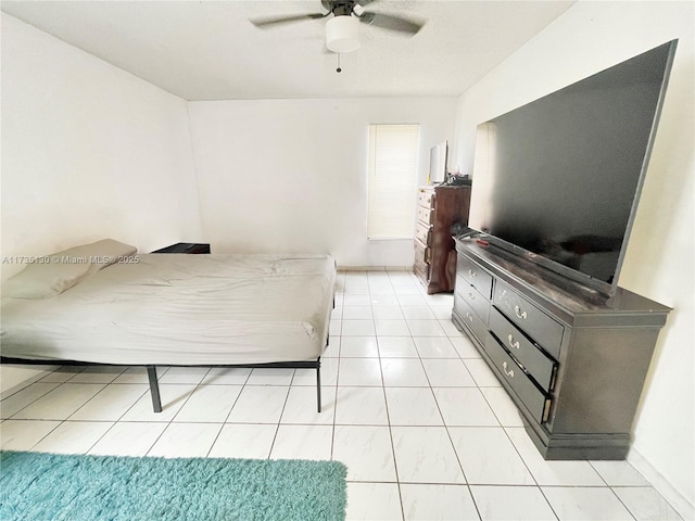 tiled bedroom with ceiling fan