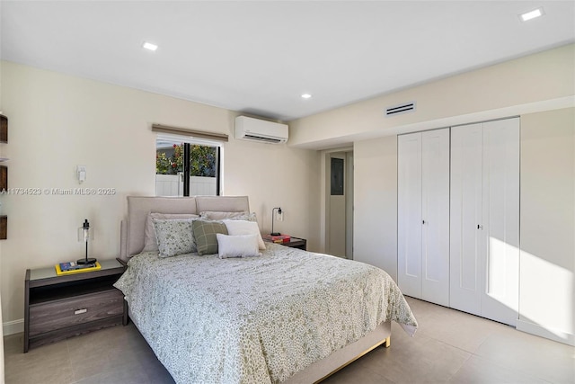 tiled bedroom with a wall mounted air conditioner and a closet