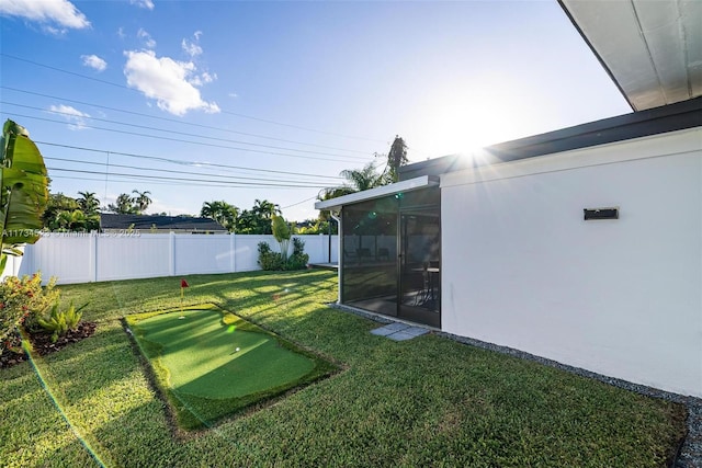 view of yard with a sunroom