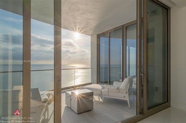 balcony featuring a water view