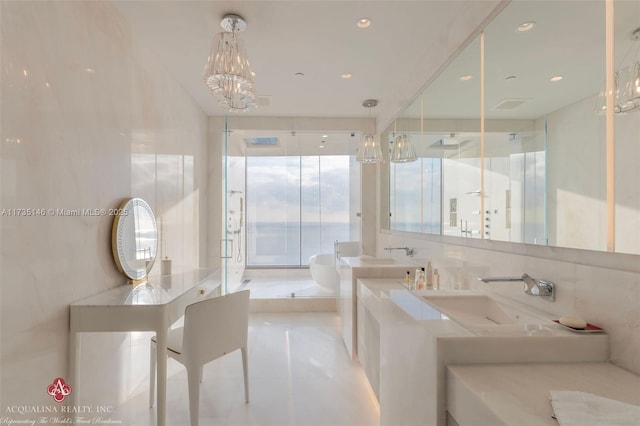 bathroom with vanity, a notable chandelier, and tile walls