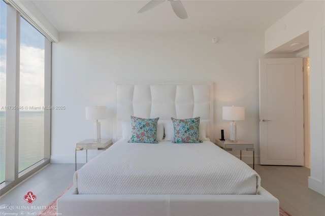 bedroom featuring ceiling fan and access to exterior