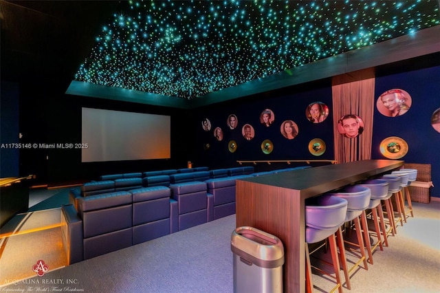 home theater room with carpet and bar