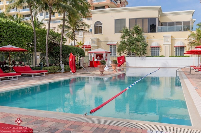 view of swimming pool featuring a patio area