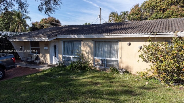 view of property exterior featuring a yard