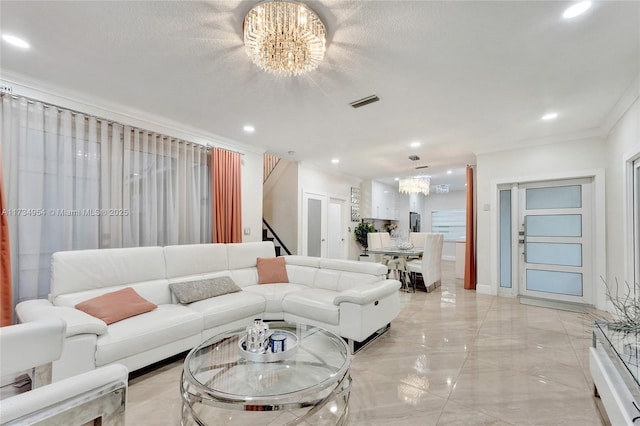 living room featuring an inviting chandelier, crown molding, and a textured ceiling