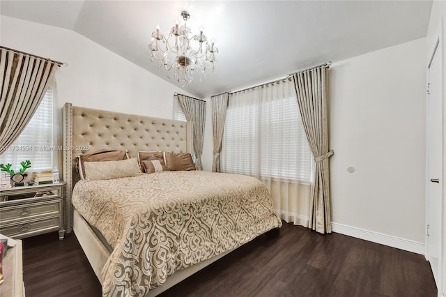bedroom featuring an inviting chandelier, baseboards, dark wood-style flooring, and lofted ceiling