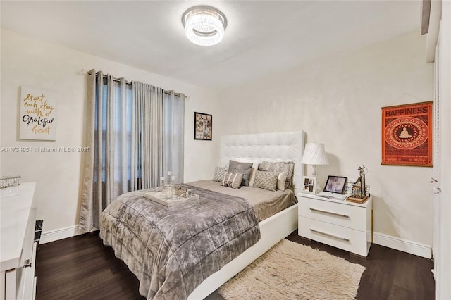 bedroom featuring dark wood-type flooring