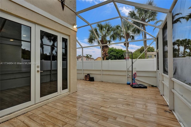 unfurnished sunroom with french doors