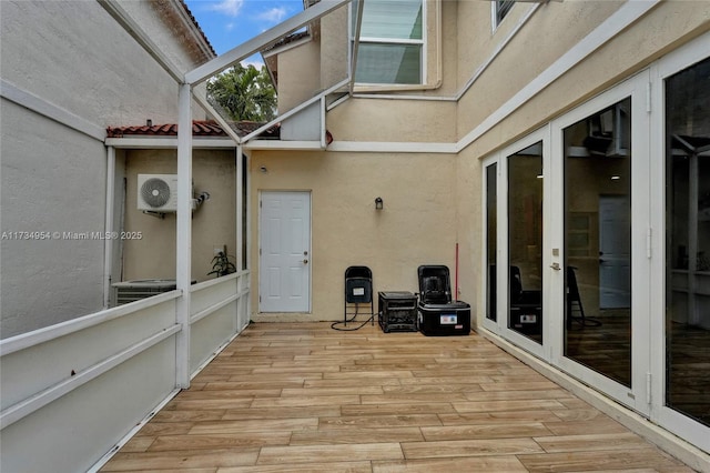 view of patio featuring french doors and a deck